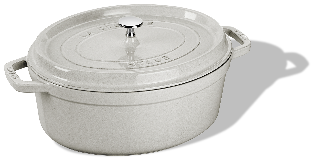 Biały, owalny garnek żeliwny Staub z pokrywką, 2,4 l, 23 cm.