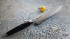 Japoński nóż Santoku Mcusta Zanmai Revolution na ozdobnym tle, stal SPG2, 18 cm