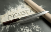 Nóż kuchenny Mcusta Zanmai Gyuto na mące z wałkiem, seria Supreme Hammered.