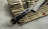 Nóż Santoku Mcusta Zanmai Classic Pro Zebra, 18 cm, na tle tektury falistej