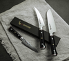 Nóż Santoku Mcusta Zanmai Classic Pro Zebra, 18 cm, na lnianej serwetce.