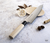 Japoński nóż kuchenny Gyuto Tojiro Shippu, 27 cm, na kamiennej powierzchni