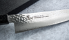 Japoński nóż Gyutoh 24 cm Sakai Takayuki Urushi VG-10 na kamiennym tle.