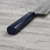 Japoński nóż kucharza Urushi Sakai Takayuki Gyutoh 24 cm na kamiennej powierzchni