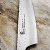 Japoński nóż Kengata Urushi Sakai Takayuki na tle kamiennego blatu, stal VG-10.
