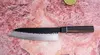 Japoński nóż Santoku Suncraft Senzo Finest na kamiennym tle z limonką