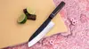 Nóż Santoku Suncraft Senzo Finest na desce z limonką