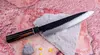 Japoński nóż kucharza Gyuto 21 cm Suncraft Senzo Finest na kamiennym tle.