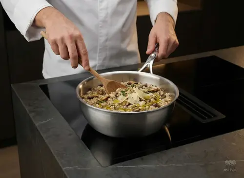 Demeyere Atlantis stalowa patelnia sauté Ø 20 cm na kuchence indukcyjnej
