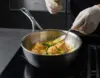 Atlantis Demeyere patelnia sauté stalowa z pokrywką, idealna do smażenia i duszenia.