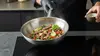 Stalowy wok Demeyere Specialities z potrawą, Ø 26 cm, 30-letnia gwarancja