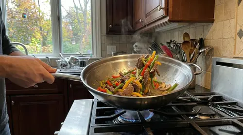 Stalowy wok Demeyere Specialities z uchwytem na kuchence gazowej