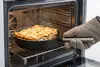 WOLL Eco Logic QXR PRO - głęboka patelnia tytanowa z lasagne w piekarniku