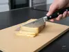 Japoński nóż uniwersalny Suncraft Senzo Professional Shotoh SG2, 13,5 cm, krojący ser na desce kuchennej